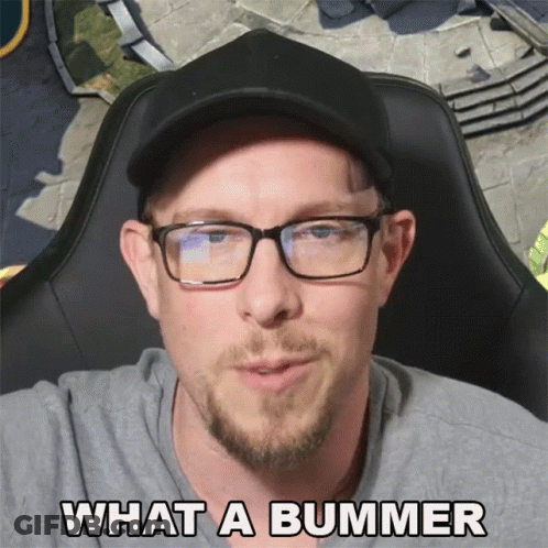 A Man Wearing Glasses And A Hat With The Words What A Bummer Below Him GIF