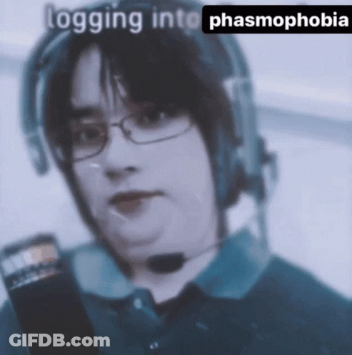 A Man Wearing Glasses And A Headset With The Words Logging Into Phasmophobia Written Below Him GIF