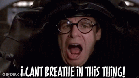 A Man Wearing Glasses And A Helmet Is Saying `` I Cant Breathe In This Thing ! '' GIF