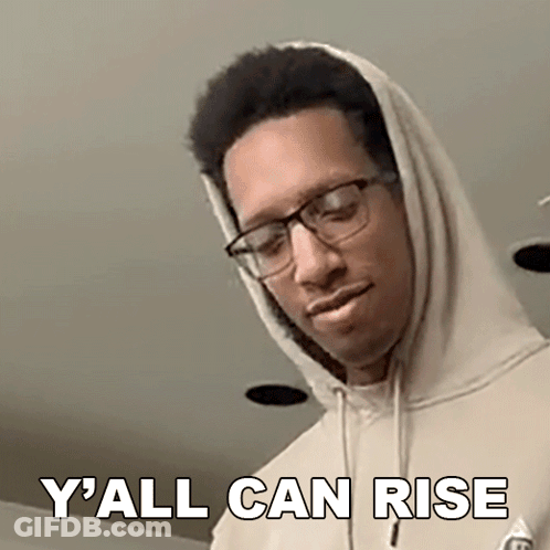 A Man Wearing Glasses And A Hoodie Is Making A Funny Face And Saying `` Y All Can Rise '' . GIF
