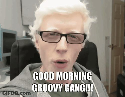 A Man Wearing Glasses And A Hoodie Says Good Morning Groovy Gang GIF