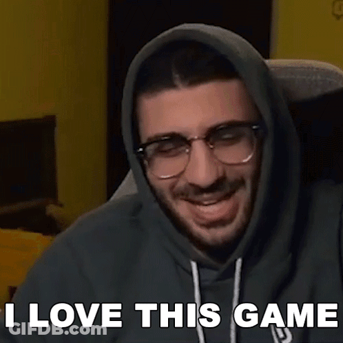 A Man Wearing Glasses And A Hoodie Says I Love This Game . GIF