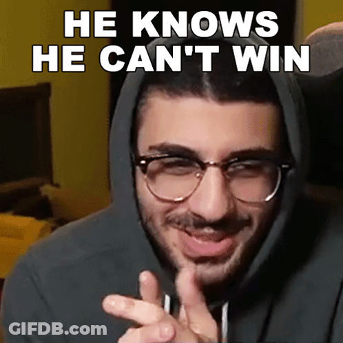 A Man Wearing Glasses And A Hoodie With The Words He Knows He Can 'T Win Above Him GIF