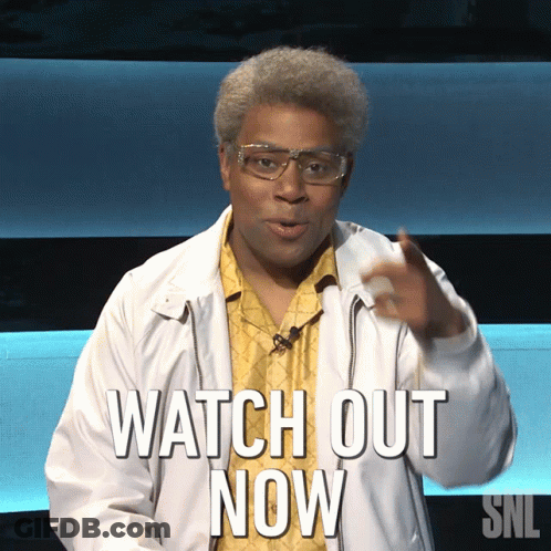 A Man Wearing Glasses And A Jacket Says Watch Out Now GIF