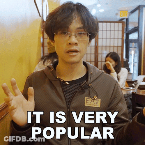 A Man Wearing Glasses And A Jacket That Says Ea7 On It GIF