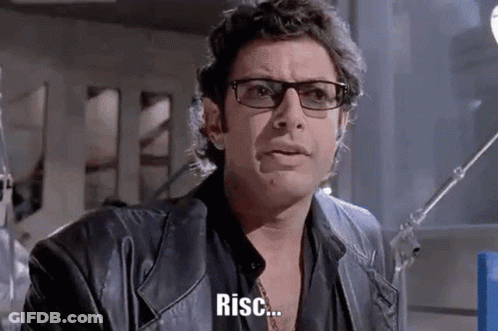A Man Wearing Glasses And A Leather Jacket Is Making A Funny Face And Says Risc . GIF