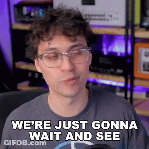 A Man Wearing Glasses And A Mercedes Shirt Says We 'Re Just Gonna Wait And See GIF