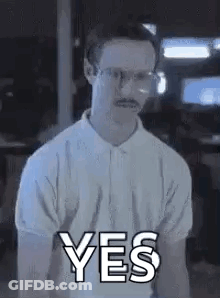 A Man Wearing Glasses And A Mustache Is Giving A Yes Sign . GIF