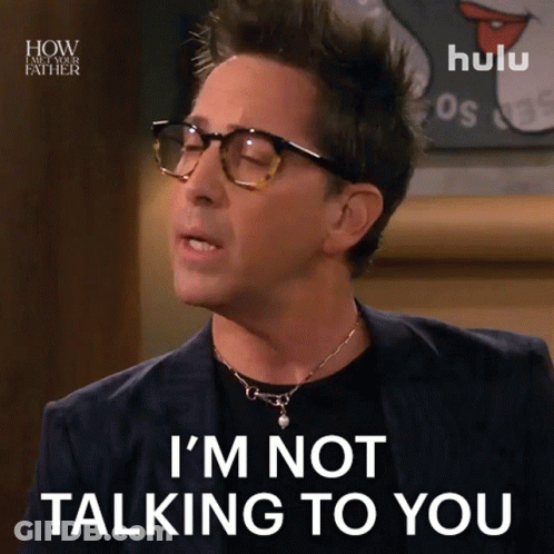 A Man Wearing Glasses And A Necklace Says I 'M Not Talking To You GIF