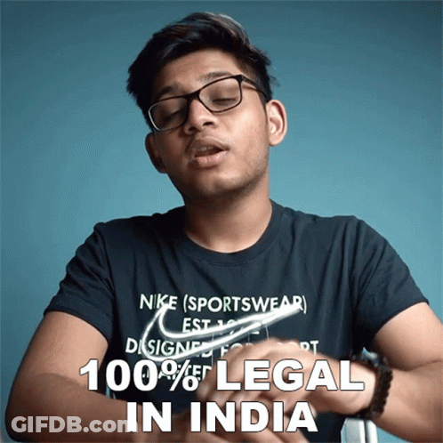 A Man Wearing Glasses And A Nike Sportswear T-Shirt Says That 100 % Of Legal In India GIF