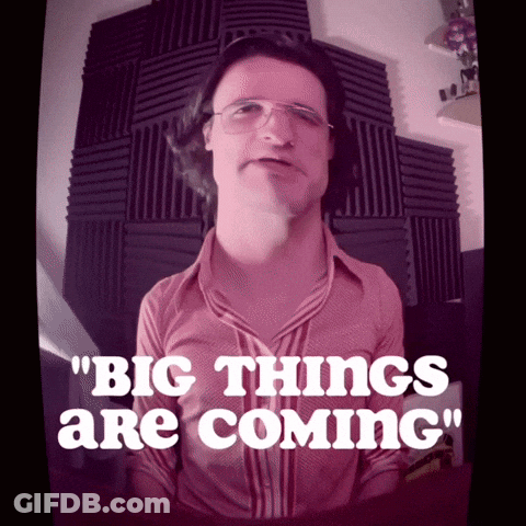 A Man Wearing Glasses And A Pink Shirt Says Big Things Are Coming GIF