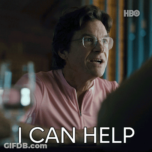 A Man Wearing Glasses And A Pink Shirt Says " I Can Help " GIF