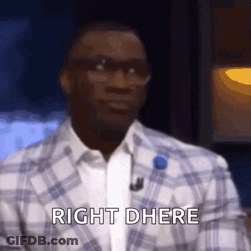 A Man Wearing Glasses And A Plaid Jacket Is Saying Right There GIF