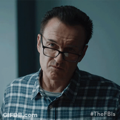 A Man Wearing Glasses And A Plaid Shirt Has #Thefbls Written On The Bottom Of His Shirt GIF