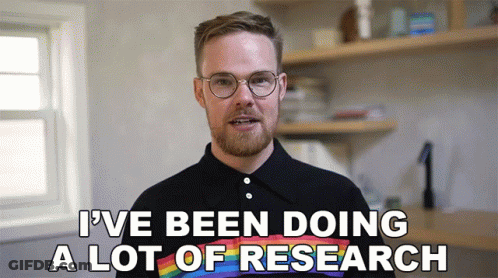 A Man Wearing Glasses And A Rainbow Shirt Says " I 'Ve Been Doing A Lot Of Research " GIF