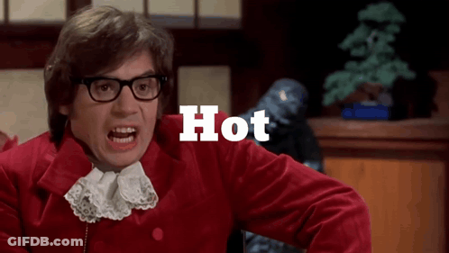 A Man Wearing Glasses And A Red Jacket Has The Word Hot Written Above Him GIF
