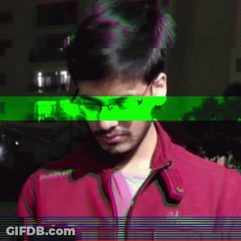 A Man Wearing Glasses And A Red Jacket With The Word Abercrombie On The Front GIF