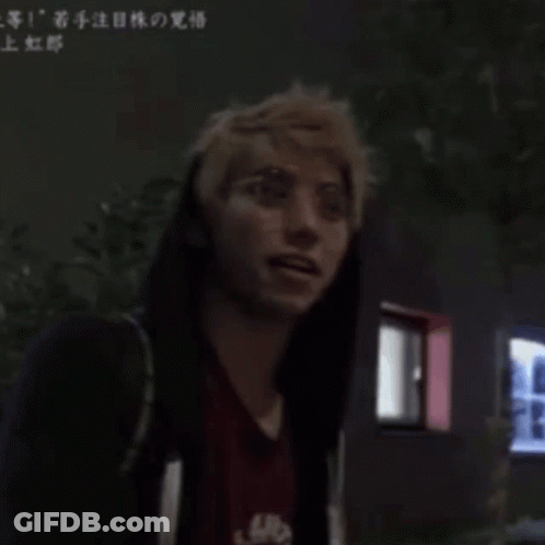 A Man Wearing Glasses And A Red Shirt Has Chinese Writing On The Bottom Right GIF