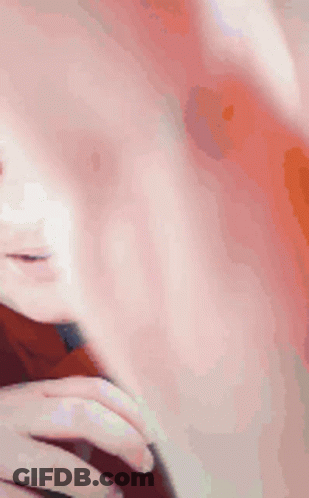 A Man Wearing Glasses And A Red Shirt Is Smiling GIF