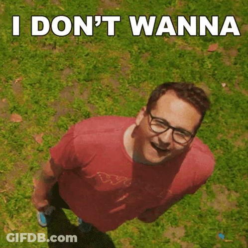 A Man Wearing Glasses And A Red Shirt Is Standing In The Grass With The Words " I Don 'T Wanna " Above Him GIF