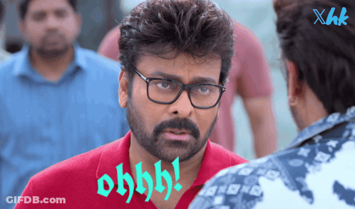 A Man Wearing Glasses And A Red Shirt Says Ohhhh GIF