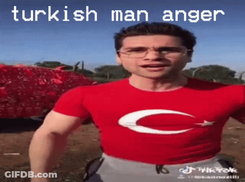 A Man Wearing Glasses And A Red Shirt With A C On It GIF