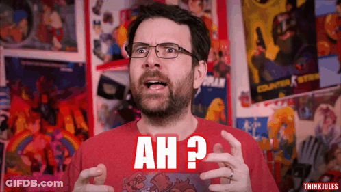 A Man Wearing Glasses And A Red Shirt With Ah Written On It GIF
