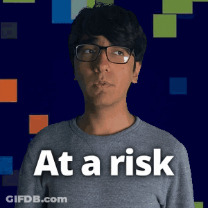 A Man Wearing Glasses And A Shirt That Says At A Risk On It GIF