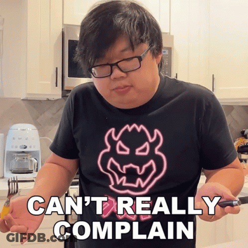 A Man Wearing Glasses And A Shirt That Says Can T Really Complain GIF