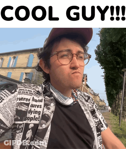 A Man Wearing Glasses And A Shirt That Says Cures Dying People On It GIF