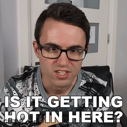 A Man Wearing Glasses And A Shirt That Says " Is It Getting Hot In Here " GIF