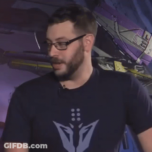 A Man Wearing Glasses And A Shirt That Says " No Raid " GIF