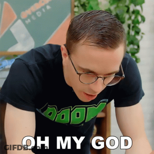A Man Wearing Glasses And A Shirt That Says " Oh My God " On It GIF