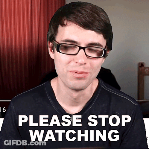 A Man Wearing Glasses And A Shirt That Says Please Stop Watching GIF