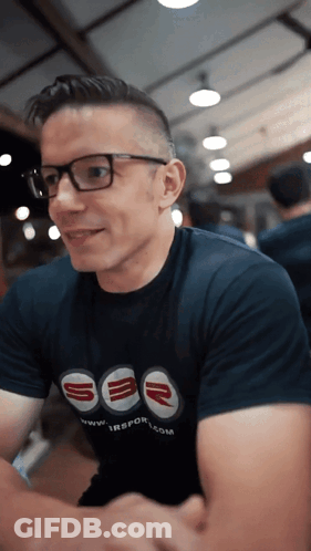 A Man Wearing Glasses And A Shirt That Says Sbr On It GIF