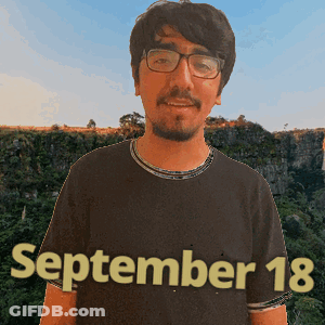 A Man Wearing Glasses And A Shirt That Says September 18 On It GIF