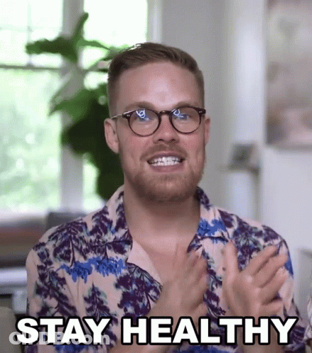 A Man Wearing Glasses And A Shirt That Says " Stay Healthy " GIF