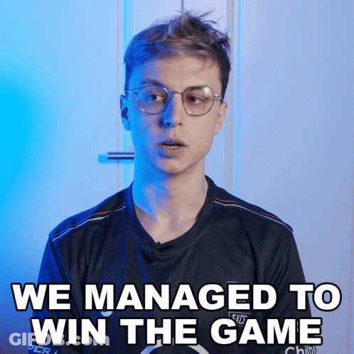 A Man Wearing Glasses And A Shirt That Says We Managed To Win The Game GIF