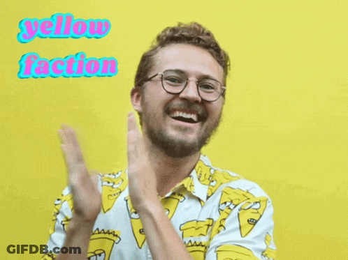 A Man Wearing Glasses And A Shirt That Says Yellow Faction Is Clapping GIF