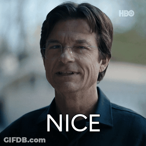 A Man Wearing Glasses And A Shirt With The Word Nice Written On His Face GIF