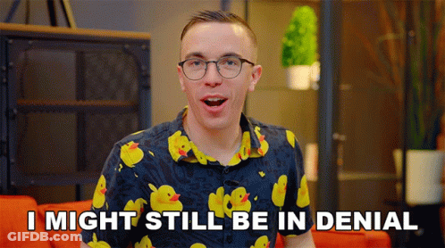 A Man Wearing Glasses And A Shirt With Yellow Ducks Says I Might Still Be In Denial GIF