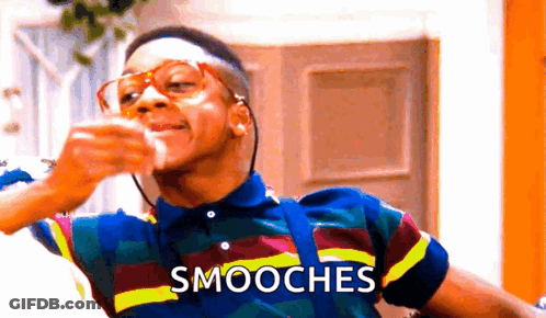 Man In Striped Shirt Drinking With Smooches GIF