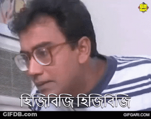 A Man Wearing Glasses And A Striped Shirt Says Gifgari.com On The Bottom Right GIF