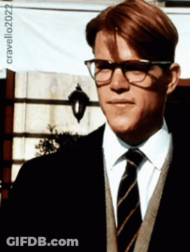 A Man Wearing Glasses And A Striped Tie Is Standing In Front Of A Sign That Says Cravello202022 GIF