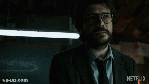 A Man Wearing Glasses And A Suit Has A Netflix Logo On The Bottom Right GIF
