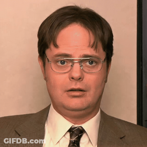 A Man Wearing Glasses And A Suit Has David Worren Written On The Bottom Right GIF