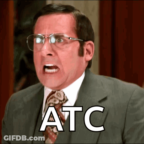 A Man Wearing Glasses And A Suit Has The Word Atc Written On His Face GIF