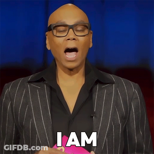 A Man Wearing Glasses And A Suit Has The Word Unbothered On His Face GIF