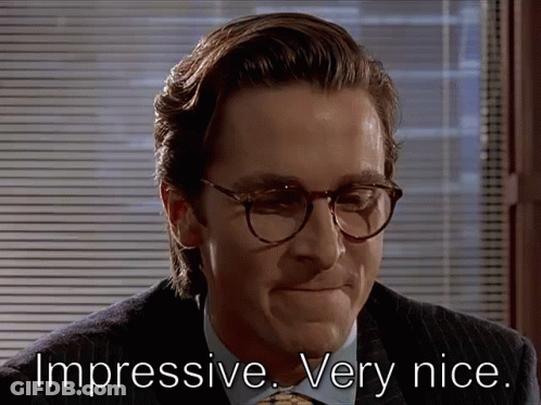 A Man Wearing Glasses And A Suit Has The Words Impressive Very Nice Written Below Him GIF