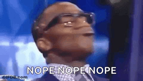 A Man Wearing Glasses And A Suit Is Making A Funny Face And Says Nope Nope Nope . GIF